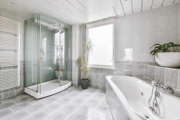 A modern bathroom with light gray tile flooring