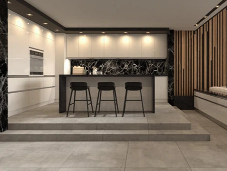 A luxurious modern kitchen with large format light grey tiles flooring