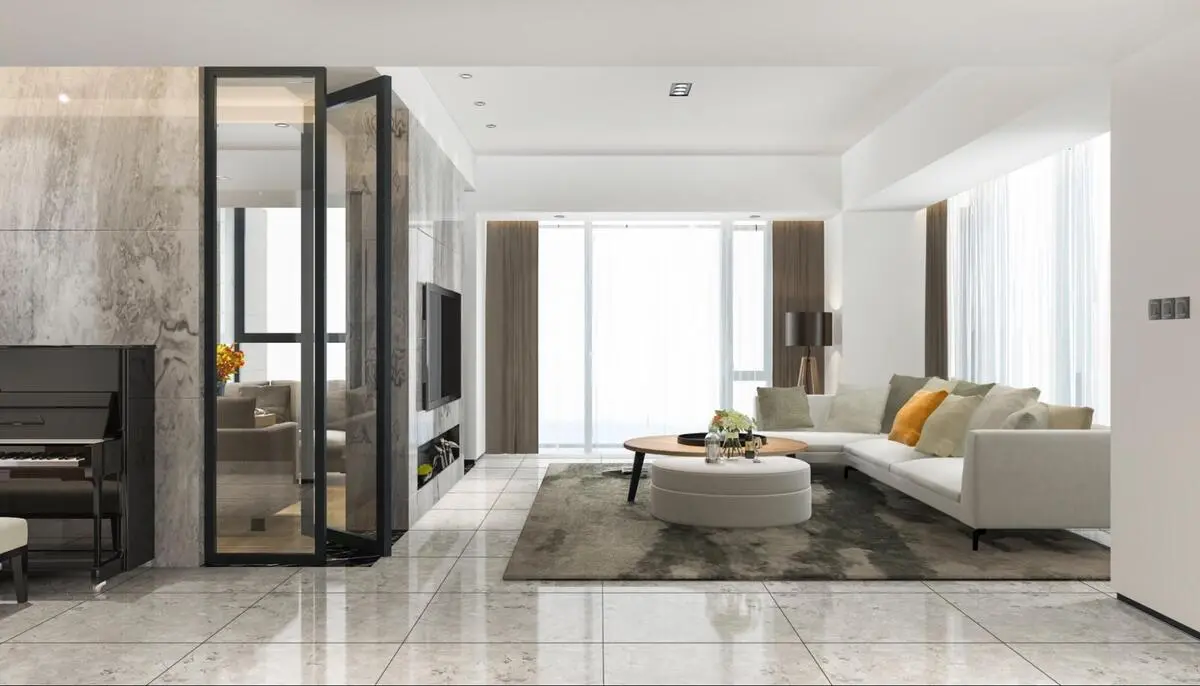 A spacious, modern living room featuring seamless large format floor tiles, contemporary furniture, and natural lighting